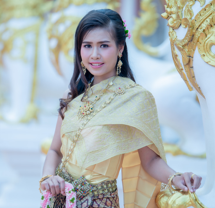 beautiful thai girl in traditional dress costume in phra that ch