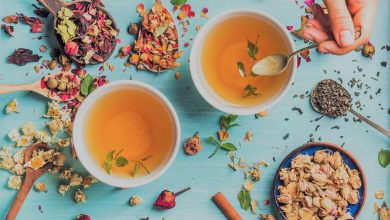 two cups of healthy herbal tea with mint, cinnamon, dried